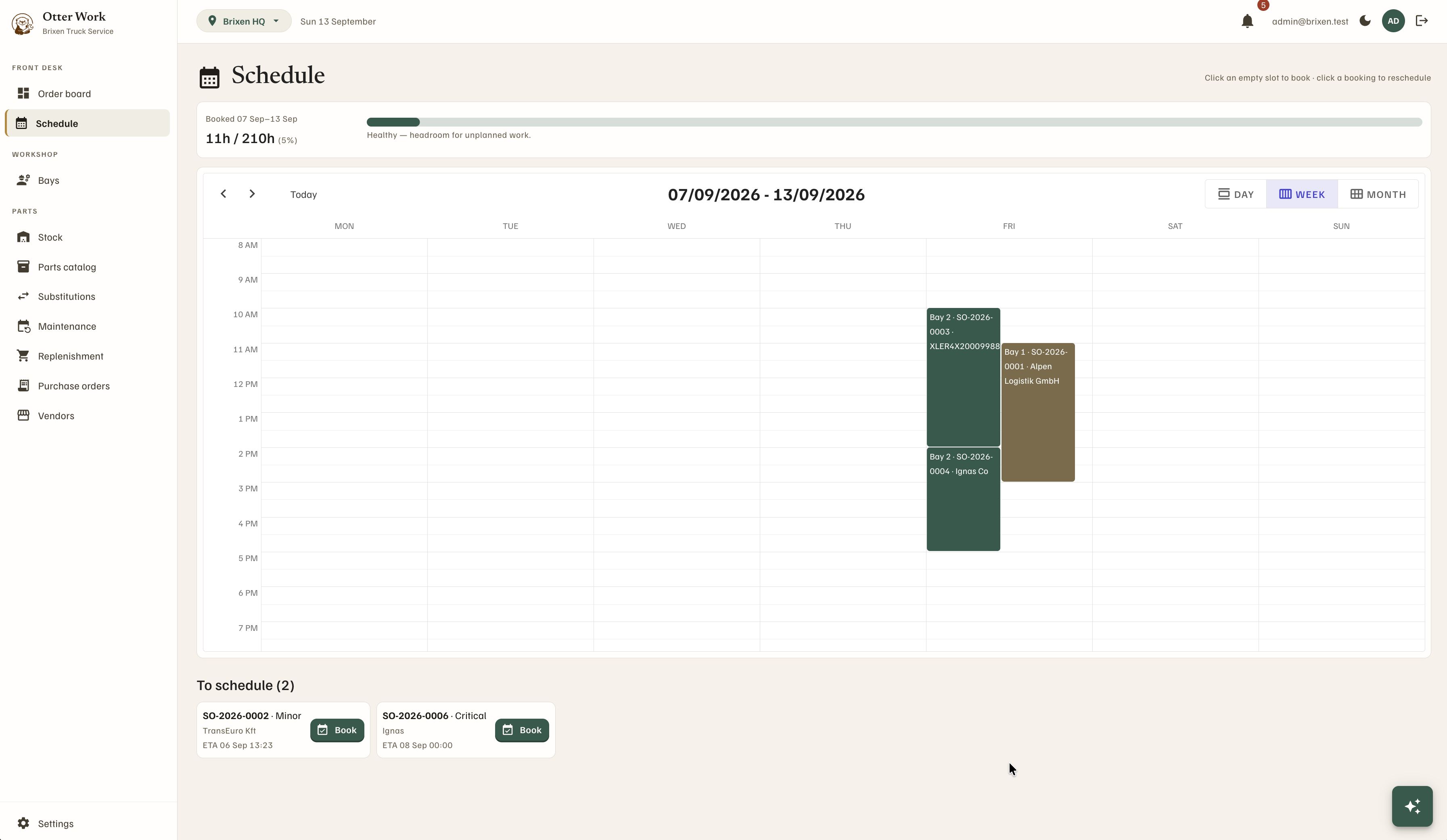 Week schedule view with bay bookings and a capacity headroom bar